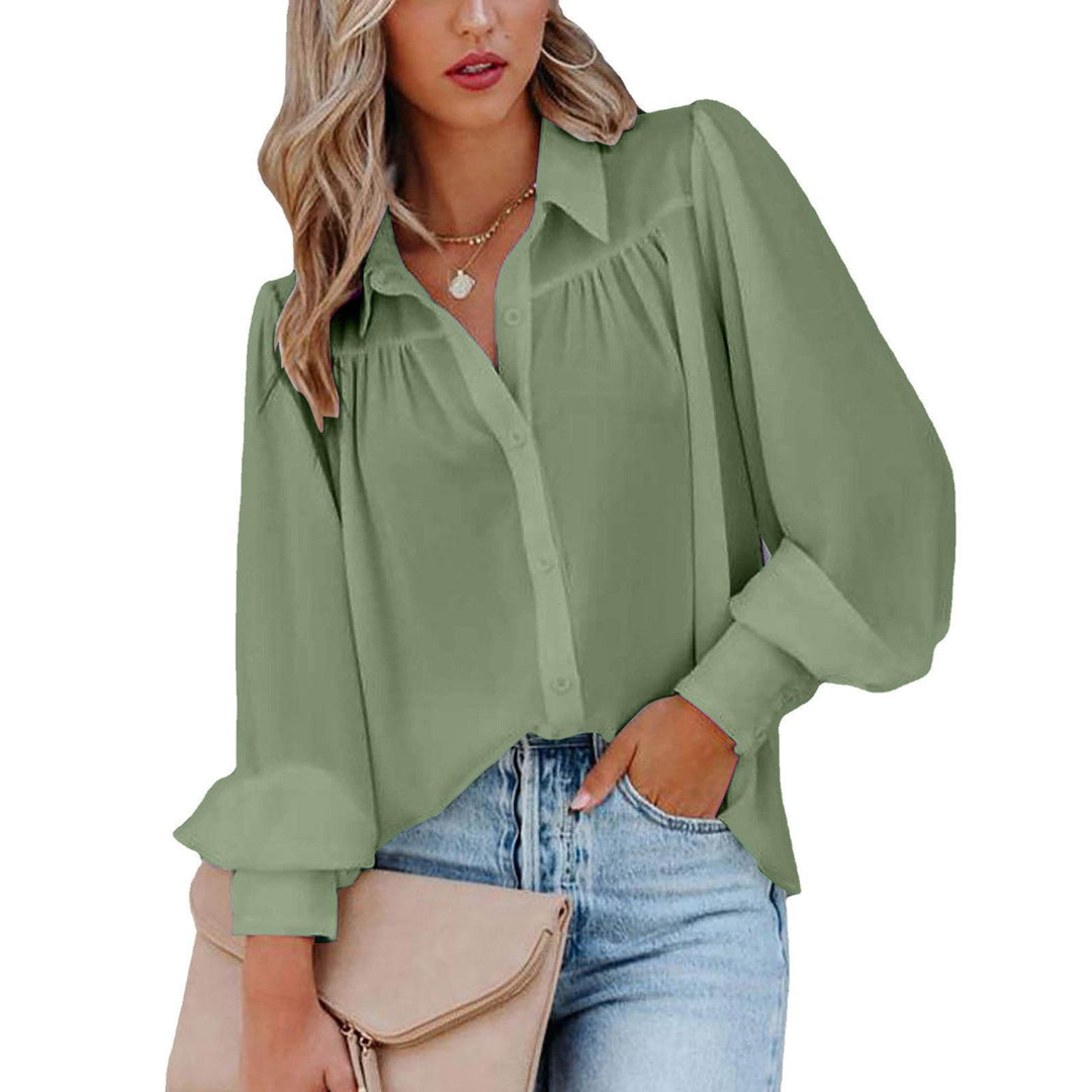 Damebluse med voluminøse ærmer og elegante flæsedetaljer Stilla