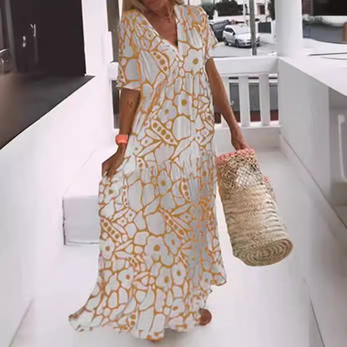 Dame Maxi-kjole med blomsterdesign og svingende kant Stilla