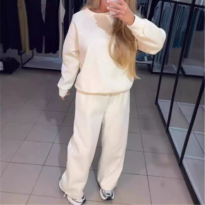 Kvinders sporty lounge sæt med glitrende detaljer og løs pasform Stilla