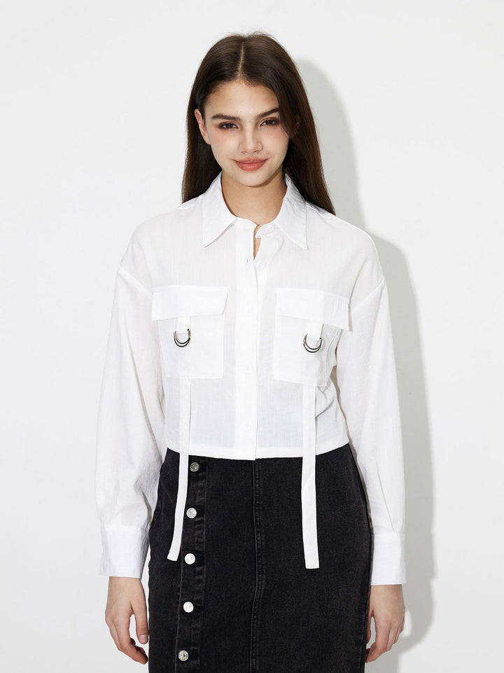 Kvinders cropped skjorte bluse med praktiske lommer og moderne detaljer Stilla