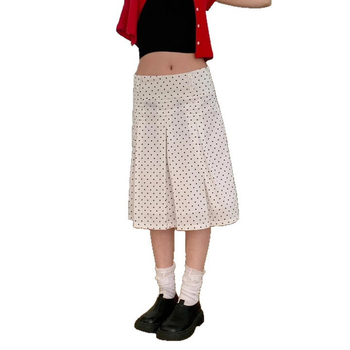 Dame midi skirt with playful polka dot pattern and elegant A-line Skovae