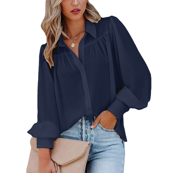 Dame elegant bluse med voluminøse ærmer og knapdetaljer Stilla