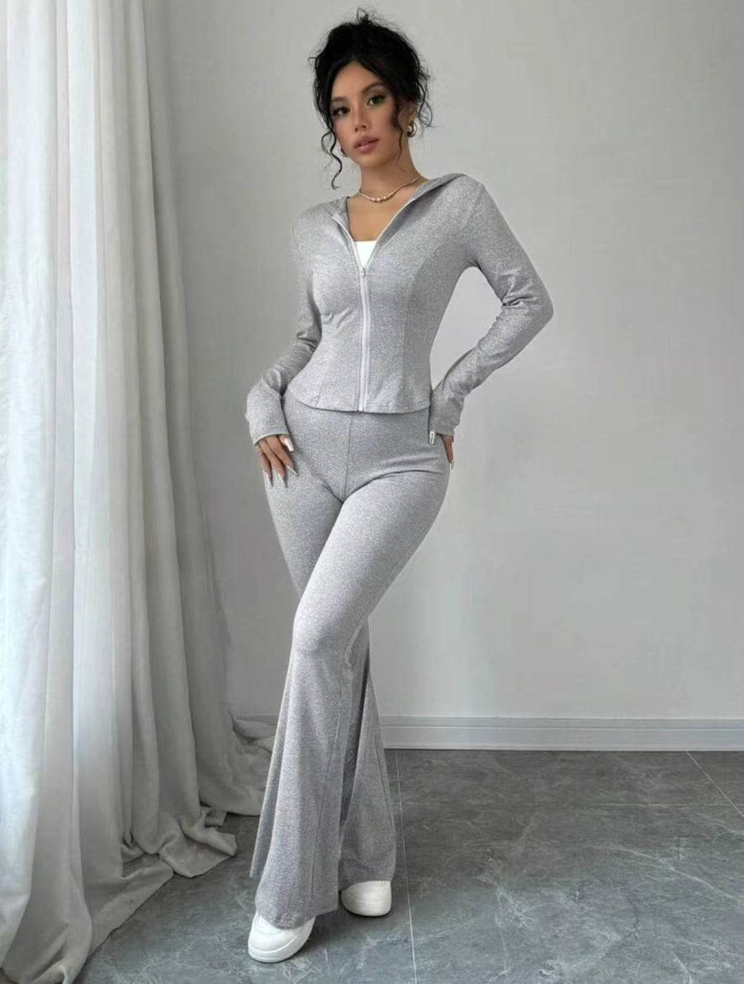 Dame Sporty Jumpsuit i elastisk materiale med lynlås Stilla