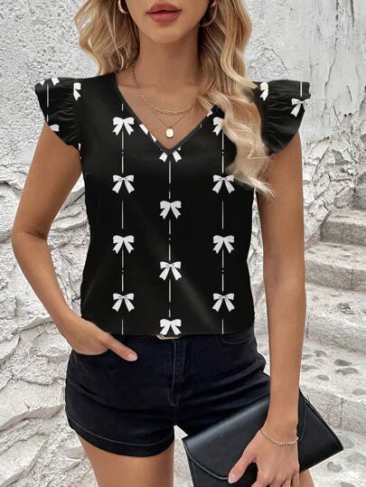 Dame blusenshirt med flæsedetaljer og legende sløjfemønster Stilla