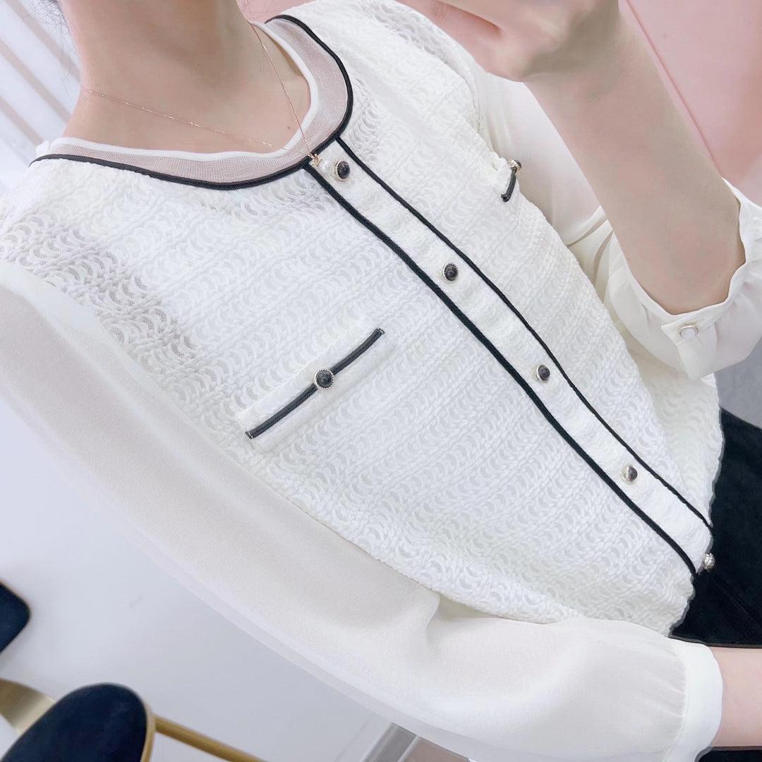 Damebluse med moderigtige indvævede mønster og elegante knapdetaljer Stilla