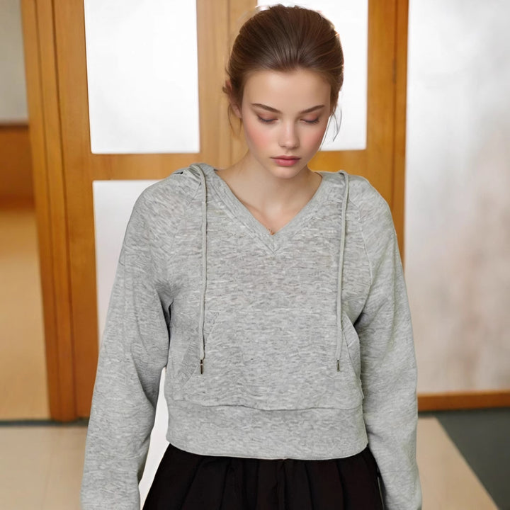 Dame V-hals sweatshirt med praktisk frontlomme-design og afslappet snit Stilla