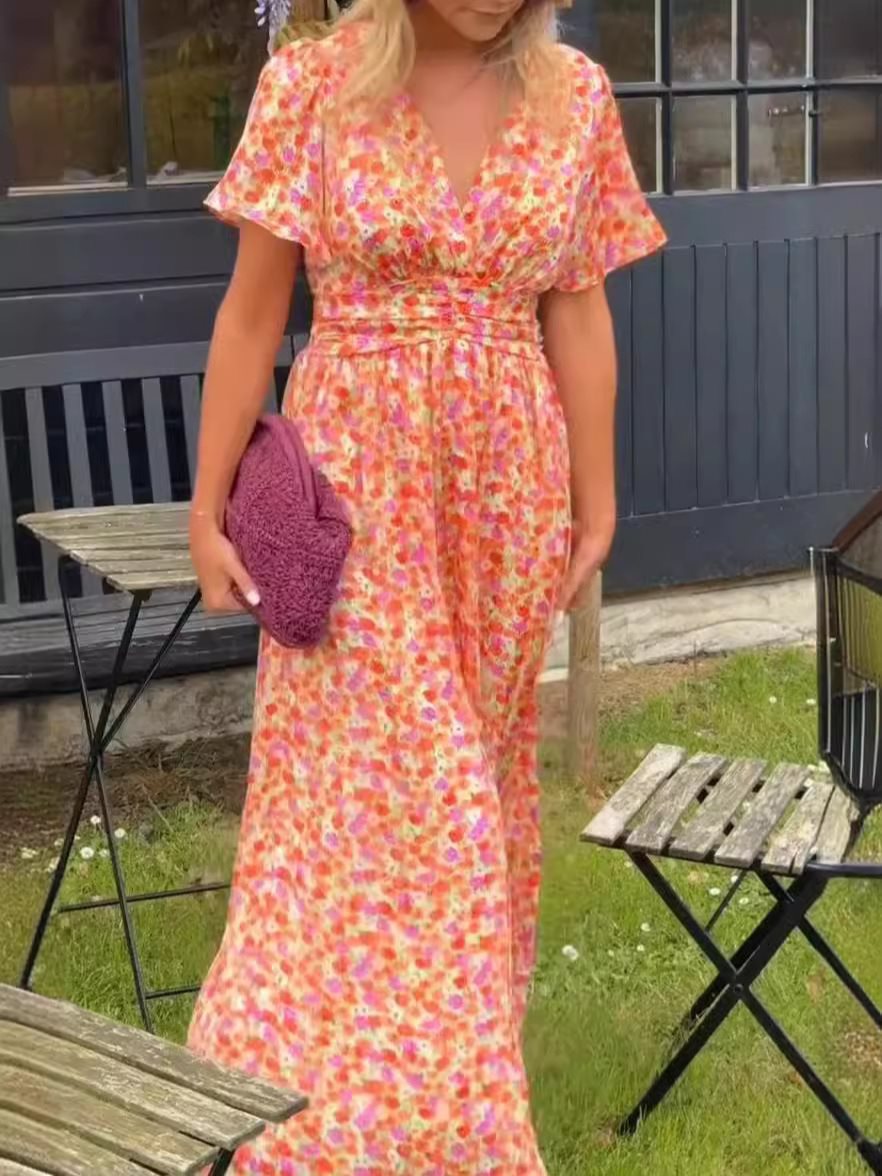 Dame maxikjole med elegant V-udskæring og legesyg puffærme Stilla