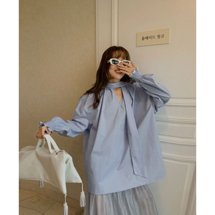Dame Oversized Bluse med gennemgående indpakningsdesign og elegante detaljer Stilla