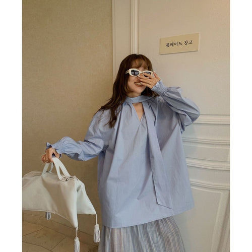 Dame Oversized Bluse med gennemgående indpakningsdesign og elegante detaljer Stilla