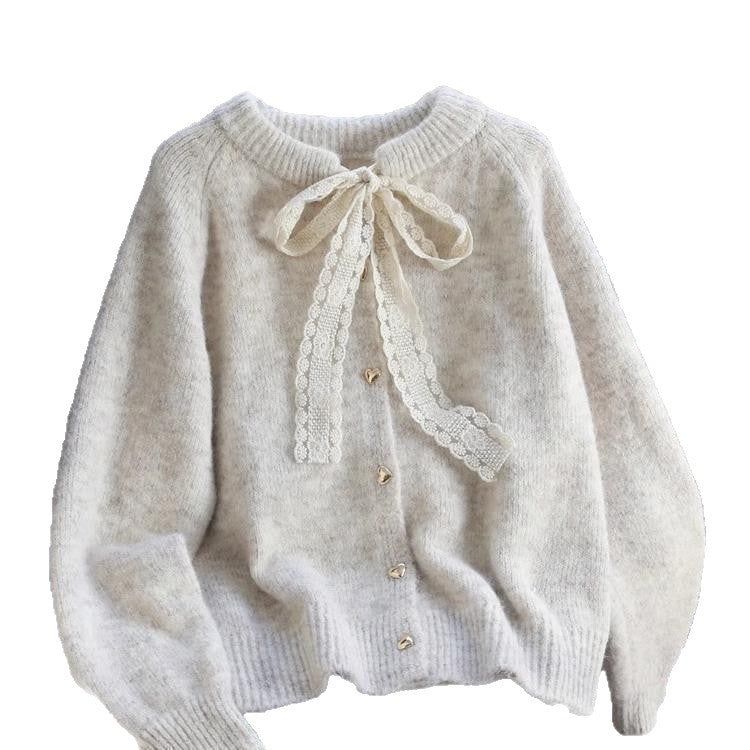 Kvinders hyggelige cardigan med hjerteknapdetaljer og bueaccent Stilla