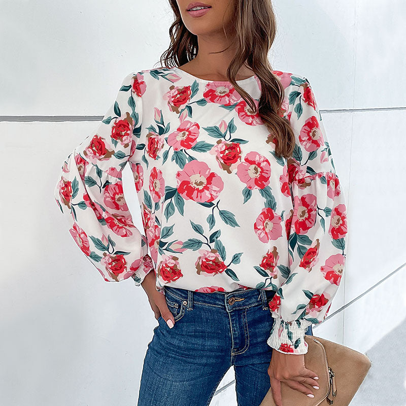 Damebluse med blomstertryk og voluminøse ærmer Stilla