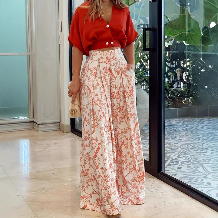 Dame elegant crop-top med knapdetaljer og maxiskirt med blomsterprint Stilla