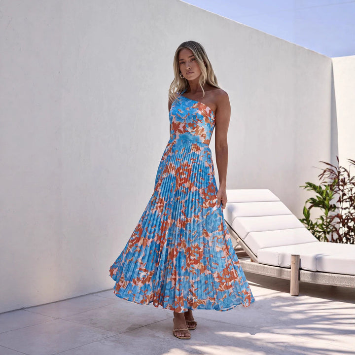 Dame maxi kjole med svingende plisseret nederdel og feminin blomsterdesign