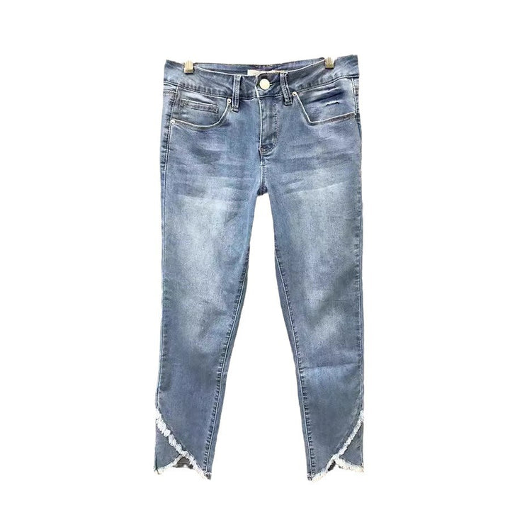 Dame mode jeans med fransede kanter og figursyet design Stilla
