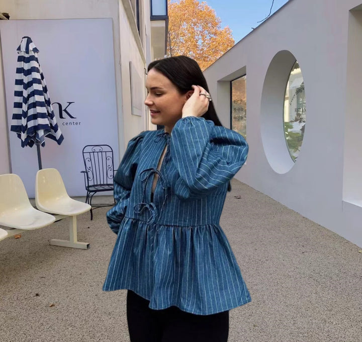 Dame skovhuggerbluse med afslappet snit og puffærmer Stilla