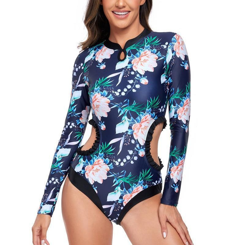 Dame elegant one-piece surfedragt med blomstermønster og cut-out-detaljer Stilla