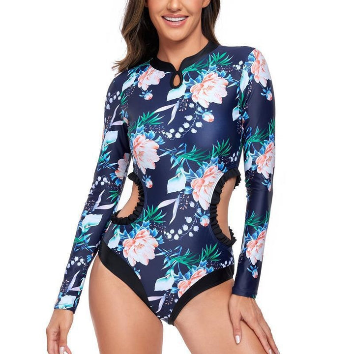 Dame elegant one-piece surfedragt med blomstermønster og cut-out-detaljer Stilla