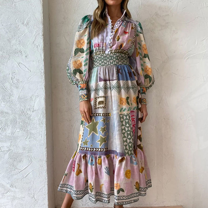 Kvindernes lange maxi kjole med farverigt patchwork mønster og voluminøse ærmer Stilla