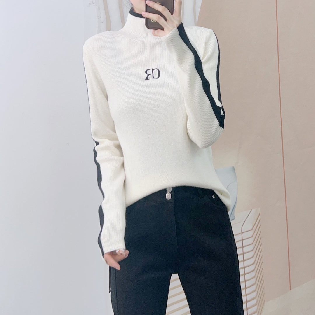 Dame elegant rullekrave sweater med kontrastærmer og moderne design Stilla