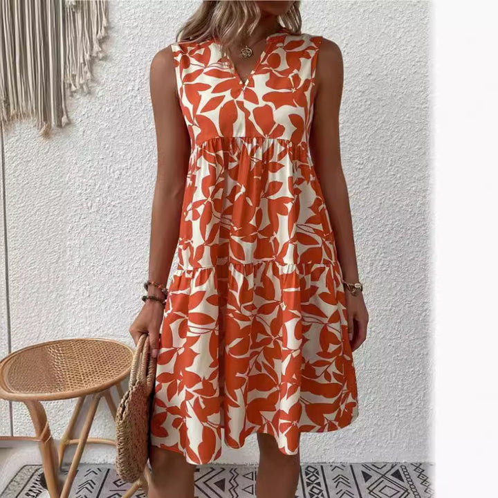 Damekollektion maxikjole med flæse og blomsterdesign Stilla
