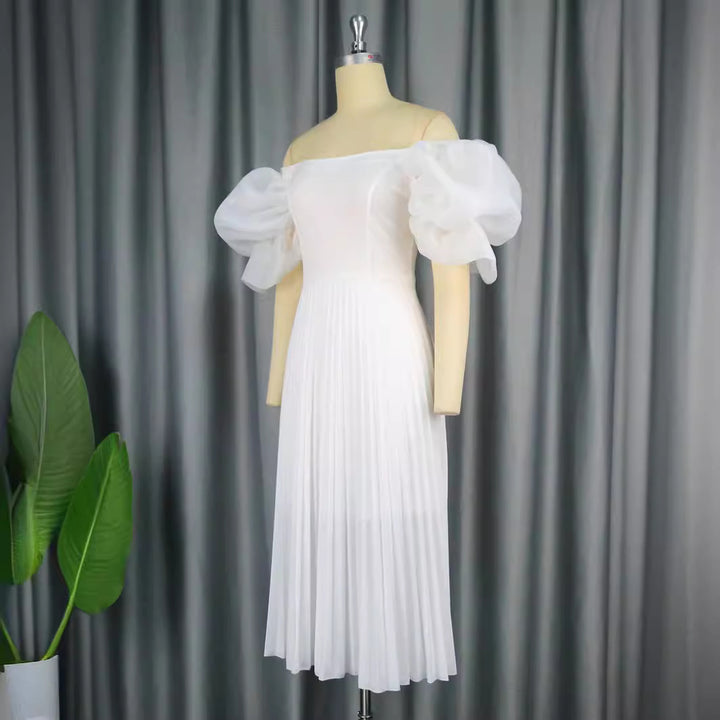 Damer Elegant kjole med voluminøse puffærmer og svingende skørt Skovae