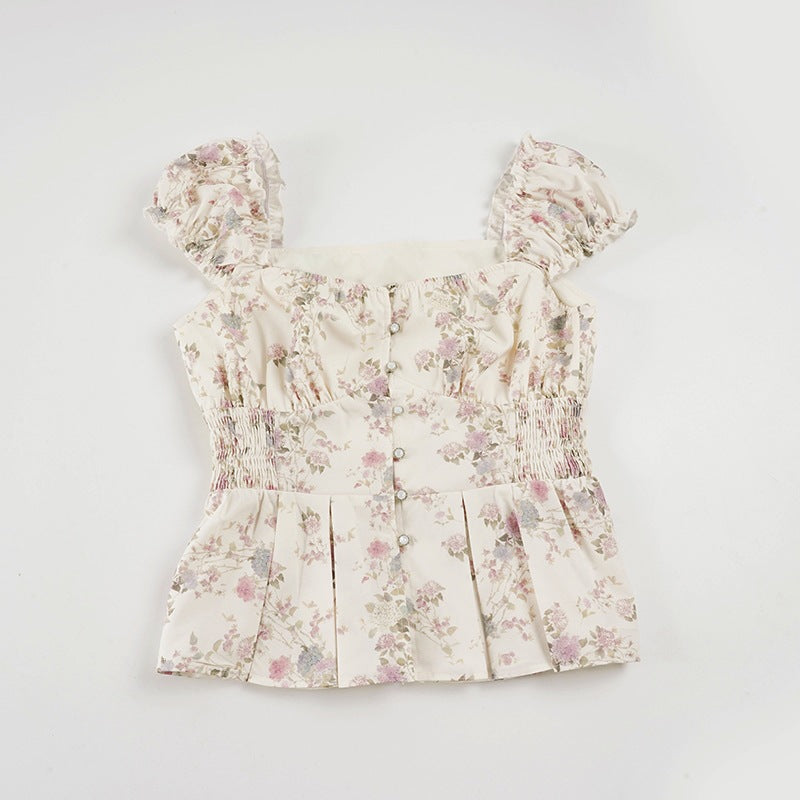 Damebluse med blomsterdesign og flæseærmer Skovae