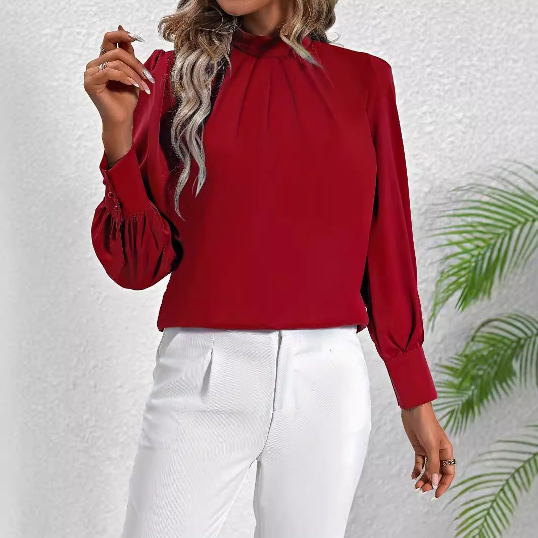 Damebluse med høj krave og elegante puffærmer Stilla
