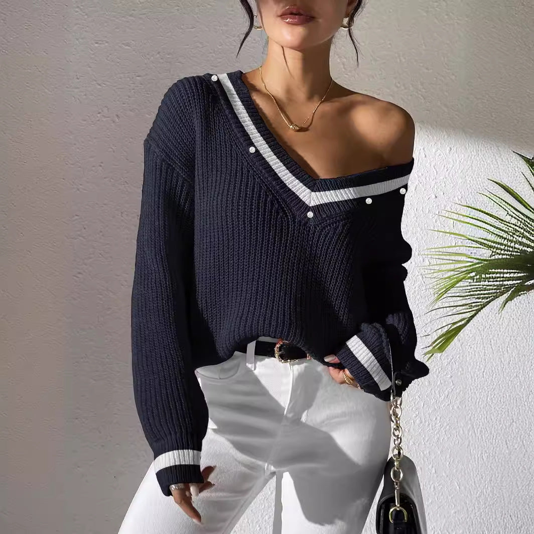 Dame oversized strikpullover med V-udskæring og elegante perledetaljer Stilla