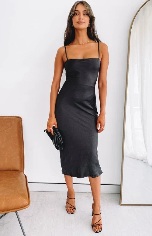 Women's satin midi dress with narrow spaghetti straps and elegant cut Skovae