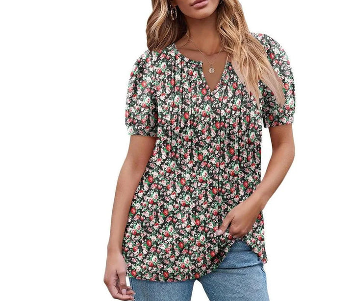 Damebluse med flæseærmer og blomsterdesign Stilla