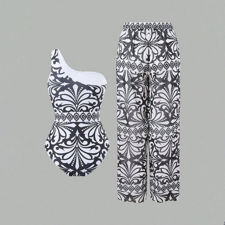 Dame one-piece badedragt med elegant asymmetrisk design og matchende bukser Skovae