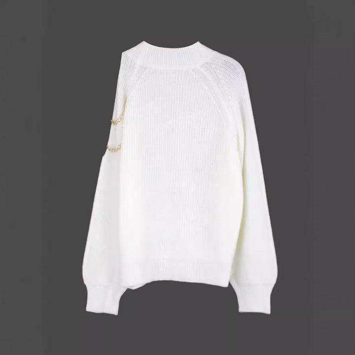 Dame moderigtig sweater med skulderdetaljer og kædeaccentuer Stilla
