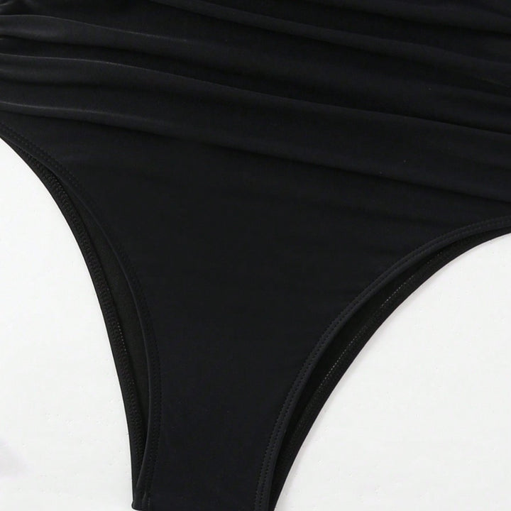 Dame Éntiler Badedragt med strategisk Cut-Out og raffinerede Ruffle-detaljer Stilla