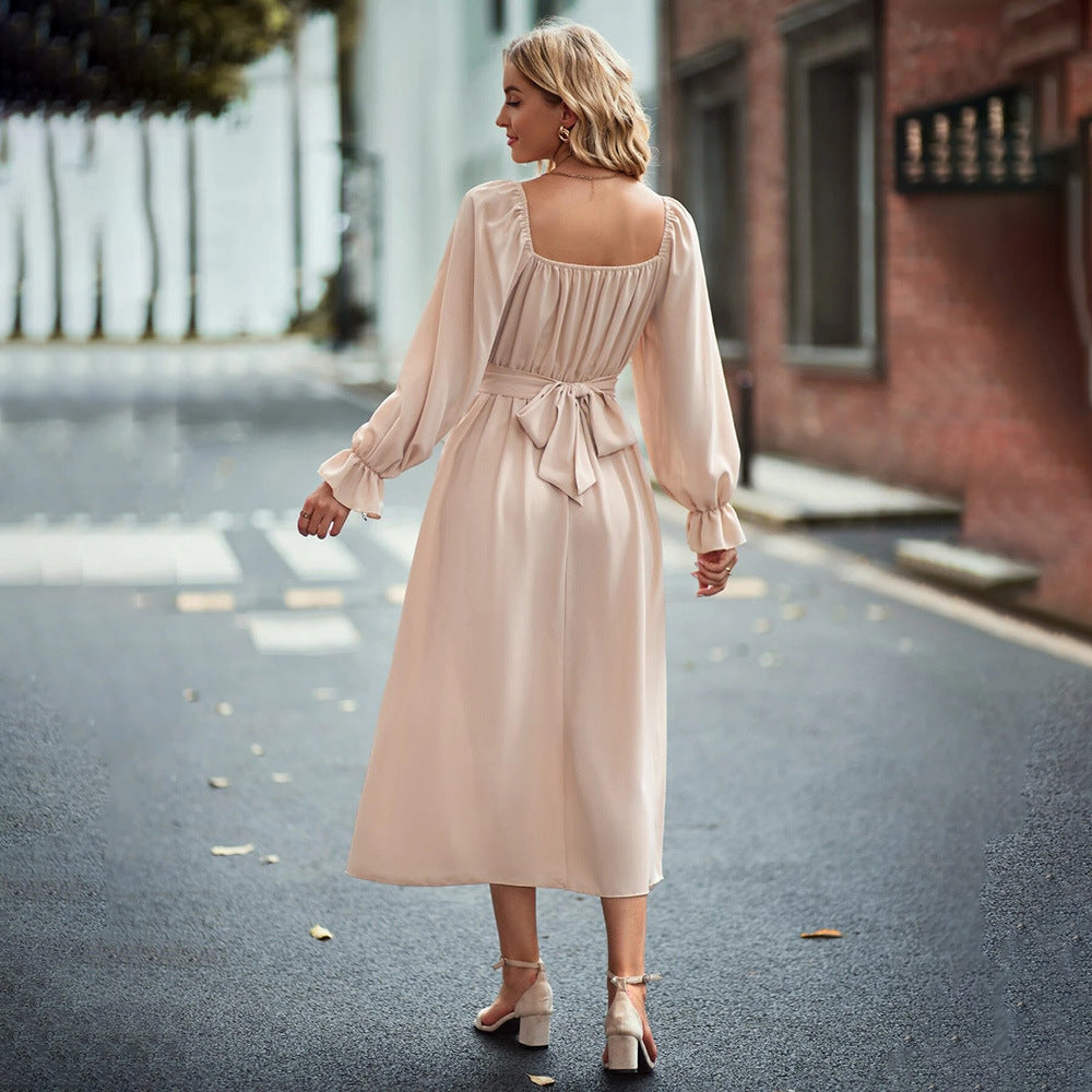 Kvinders midi kjole med elegant drapering og lange puffærmer Stilla