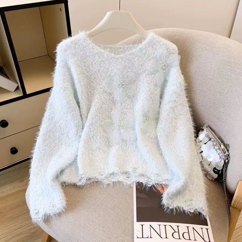 Kvindernes hyggelige sweater med blomsterapplikationer Stilla