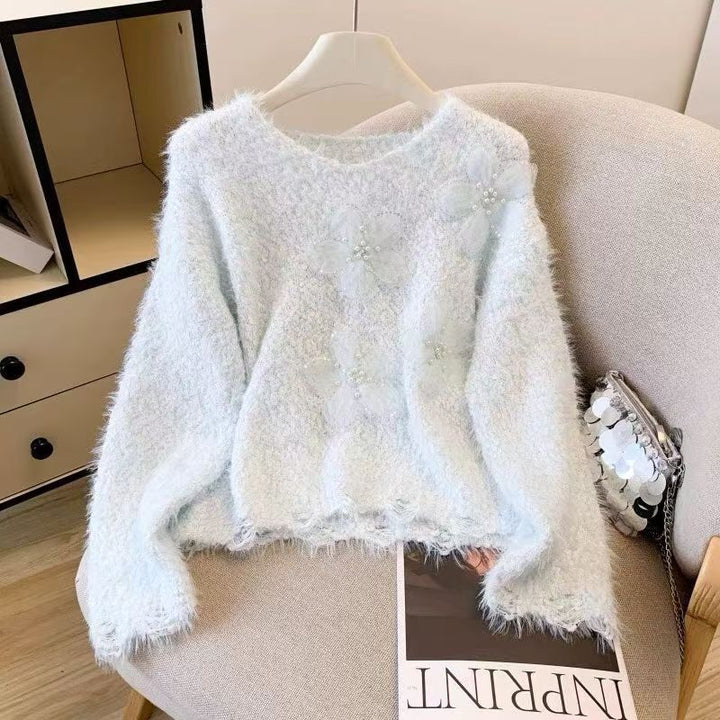 Kvindernes hyggelige sweater med blomsterapplikationer Stilla