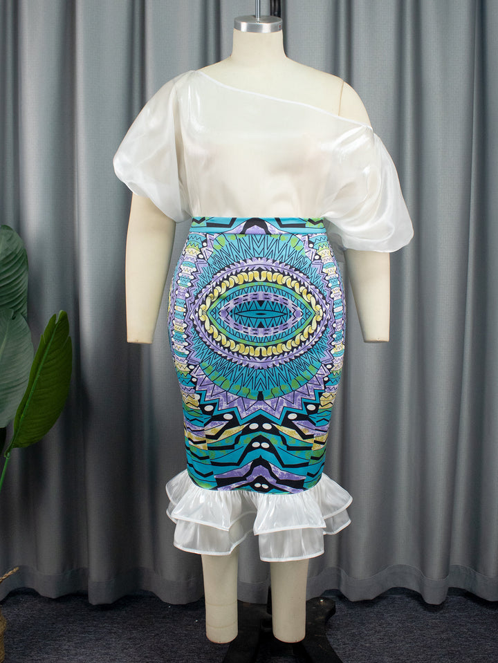 Damer Elegant kjole med asymmetrisk design og farverig print Skovae