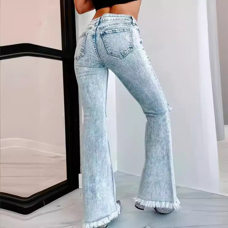 Dame flared jeans med frynset kant og moderne used-look Stilla