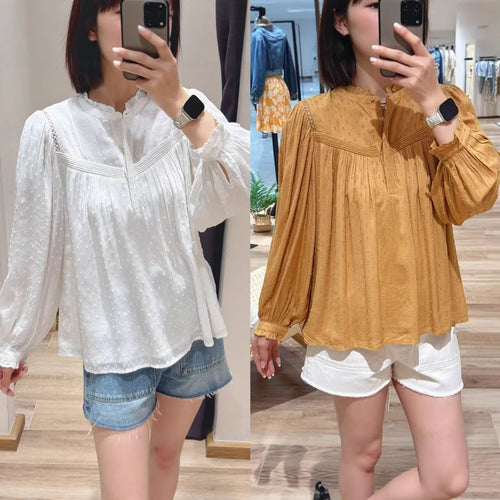 Damebluse med elegant krave og raffinerede pufærmer Stilla