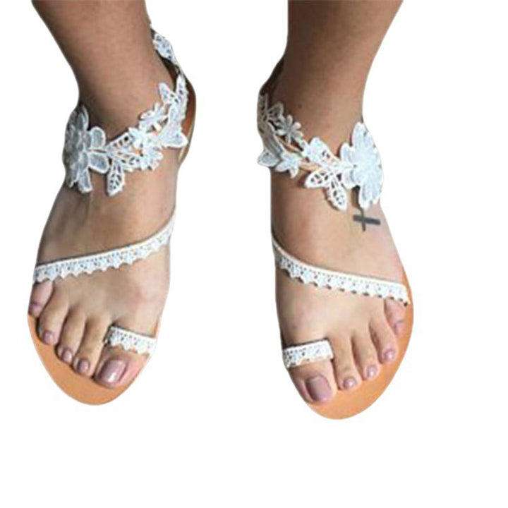 Dame fodvenlige sandaler med elegante spidser og blomsterdetaljer Stilla