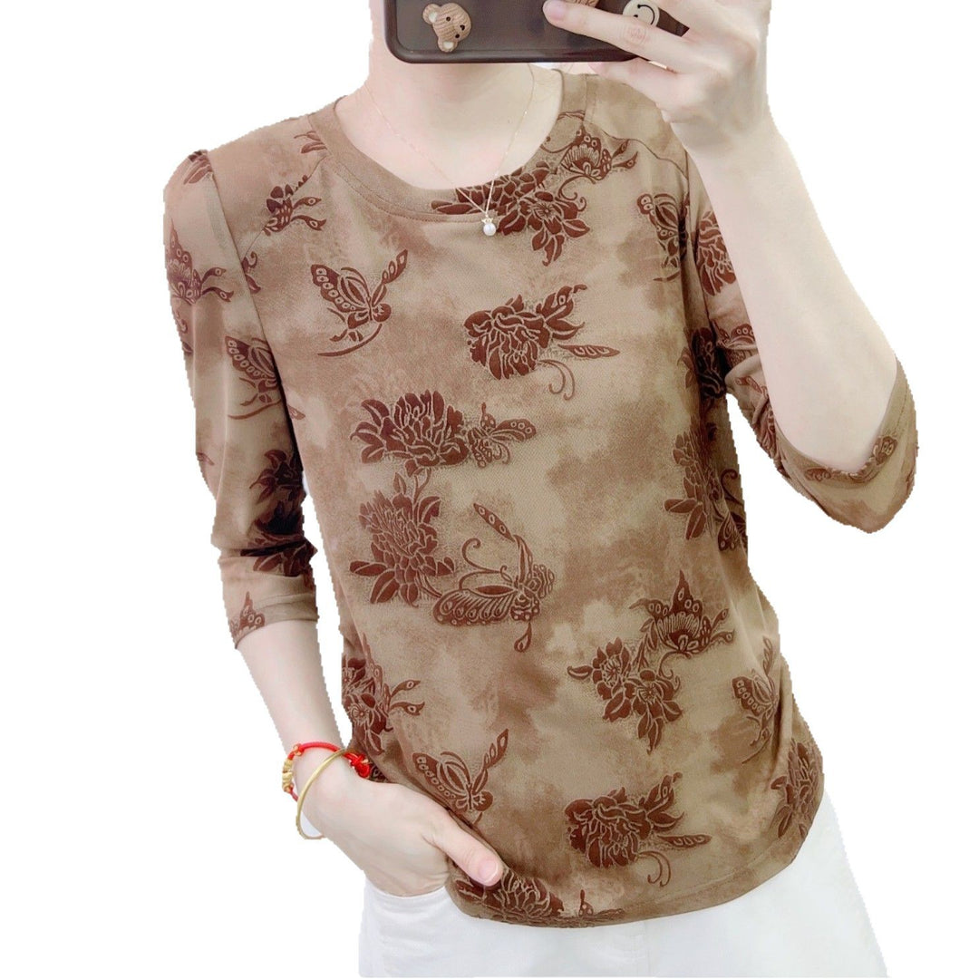 Dame mode blouse med 3/4-ærmer og blomster design Stilla