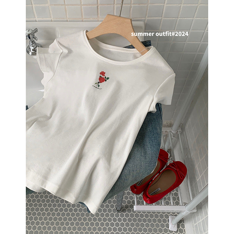 Damer casual top med blomstret design og svajende volangskørt Stilla