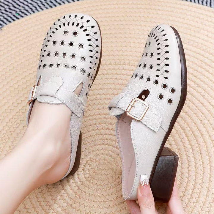 Dame Clogs med perforeret design og elegant spænde Stilla