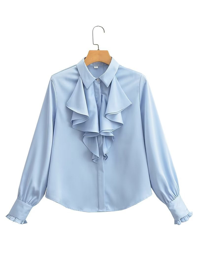 Damebluse med voluminøse flæser og elegant snit Stilla