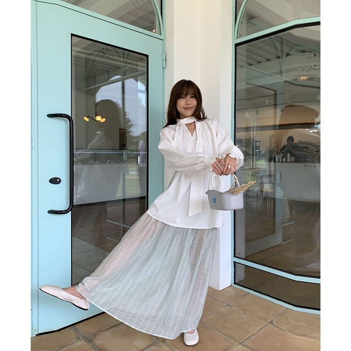 Dame Oversized Bluse med gennemgående indpakningsdesign og elegante detaljer Stilla