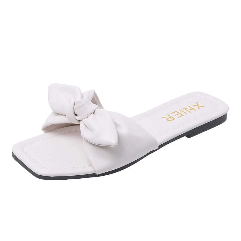 Dame mode slippers med legende sløjfe-design og behagelig sål Stilla