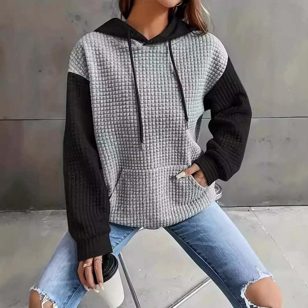 Dame hoodie med struktureret design og praktiske lommer Stilla