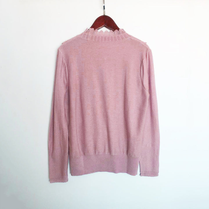Dame elegant strikpullover med flæse detaljer og perleknap lukning Stilla