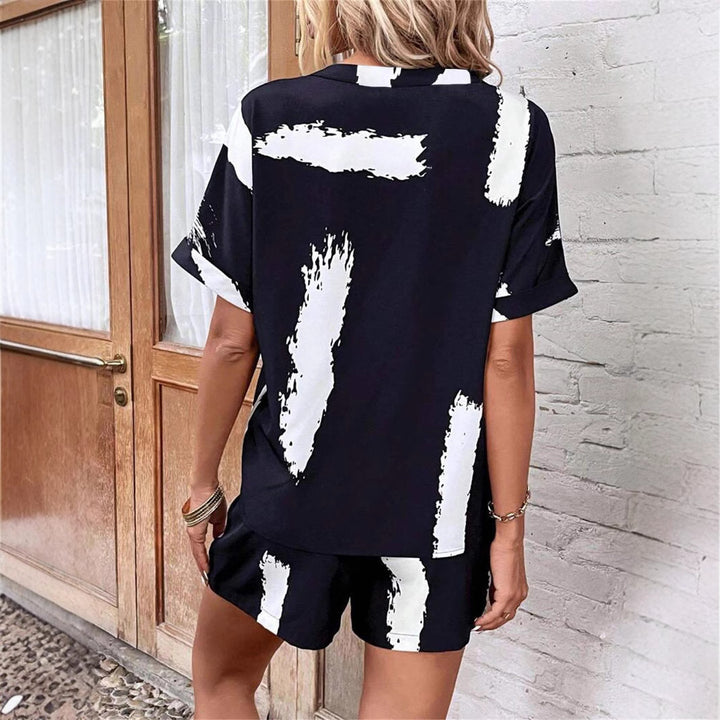 Damer kortærmet jumpsuit med moderne grafiktryk Stilla