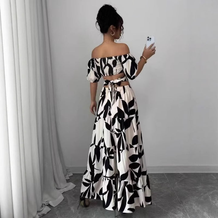 Femme Off-Shoulder Floral Maxi Kjole med lagdelt design Stilla